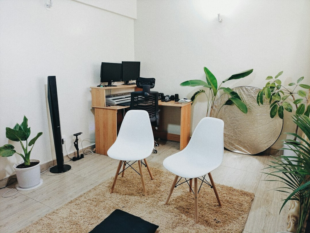 Bright open office space with editing bays and shelves of hard drives